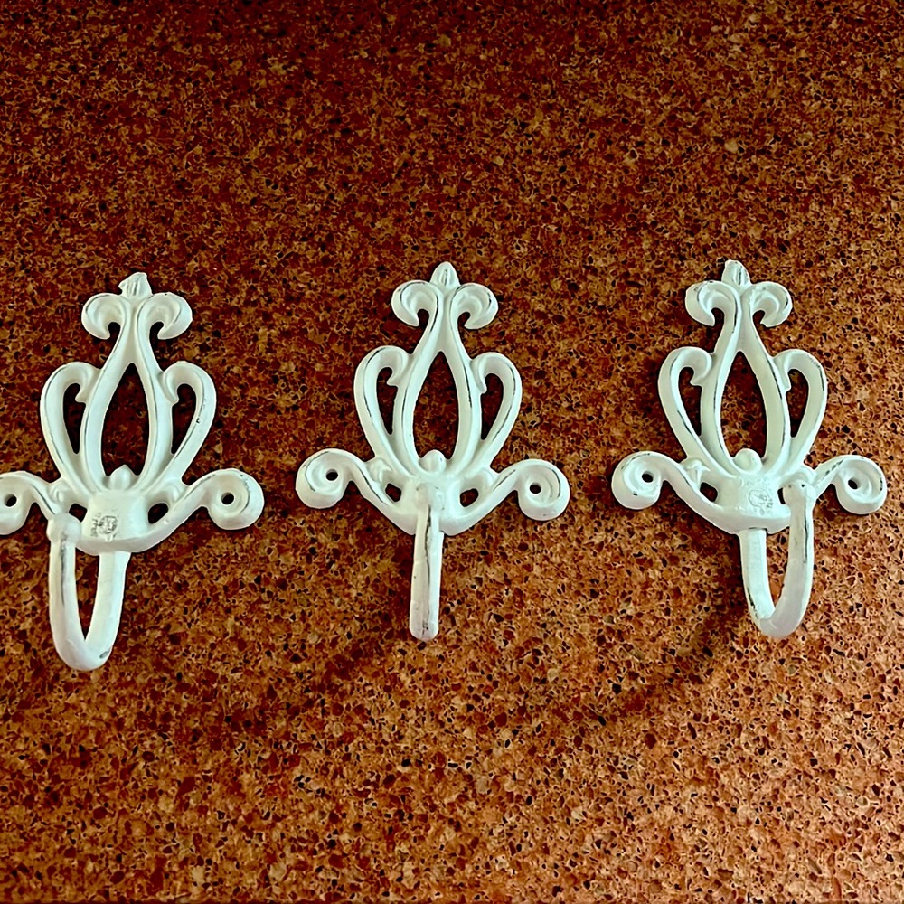 Decorative wall hooks.  Material - iron.  See picture for size.